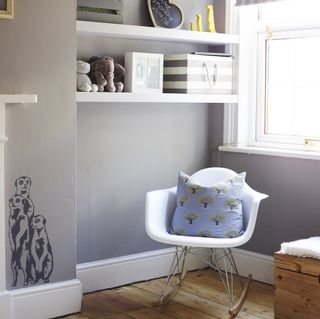grey nursery with white rocking chair