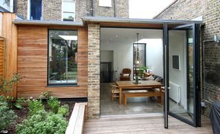Aluminium bifold doors and casement window from IQ Glass used in extension