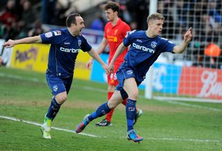 Matt Smith celebrates after scoring Oldham Athletic's first goal against Liverpool in the FA Cup, 2013