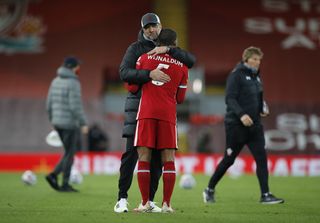 Liverpool manager Jurgen Klopp hugs Georginio Wijnaldum