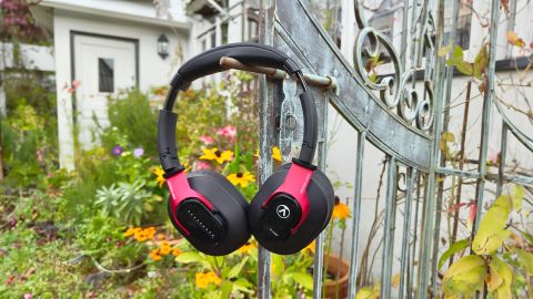 Austrian Audio Hi-X25BT over-ear headphones hanging on garden gate bolt