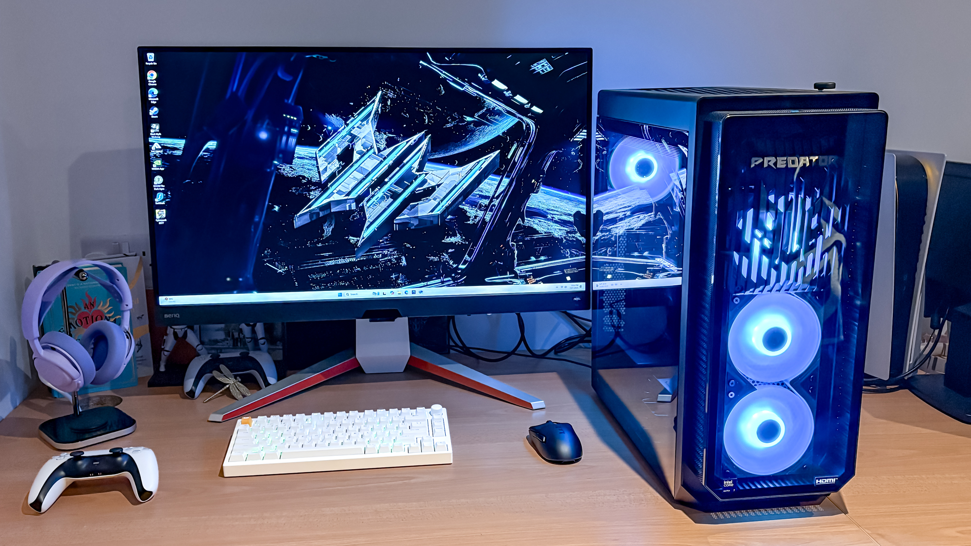 Acer Predator Orion 7000 on desk with monitor, keyboard, mouse, PS5 controller next to it in PC setup