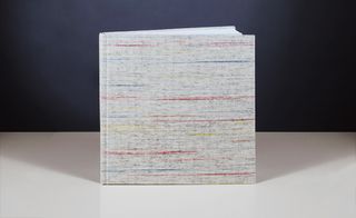 The book, entitled 'Interwoven', is bound in woven wool