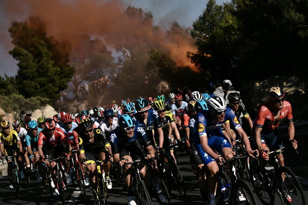 The peloton ascends a climb