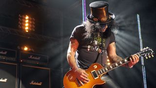 Slash playing in front of his Marshall stack