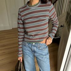 Woman in a stripe top and jeans