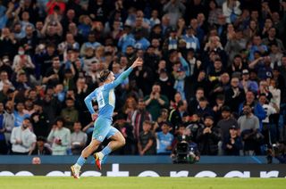 Jack Grealish celebrates scoring in the Champions League for Manchester City