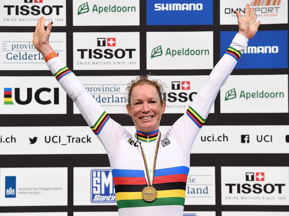 Gold medallist Netherland's Kirsten Wild celebrates on the podium after her victory in the women's scratch race at The UCI World Cycling Championships