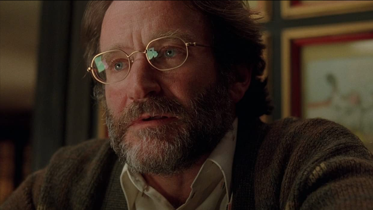 Robin Williams sits solemnly in Good Will Hunting.