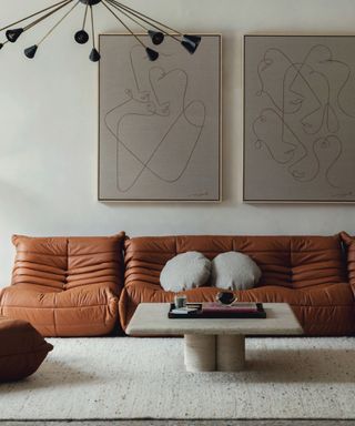 japandi style living room with tan leather sofa