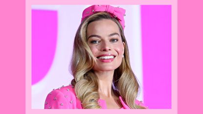 Margot Robbie's Blush: Margot pictured wearing a pink suit, with a pink makeup look and her hair in curls as she attends a press conference for "Barbie" on July 03, 2023 in Seoul, South Korea./ in a pink template