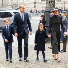 the Cambridge family walking into Westminster Abbey