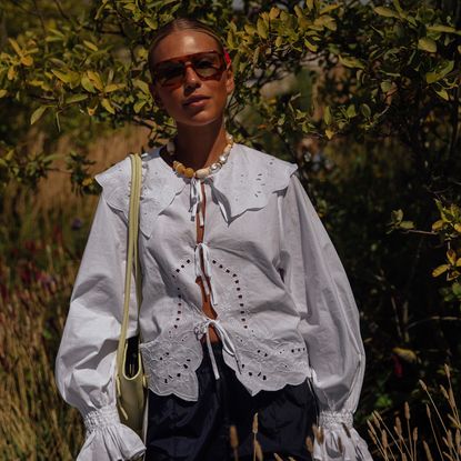 woman wearing embroidered linen shirt 