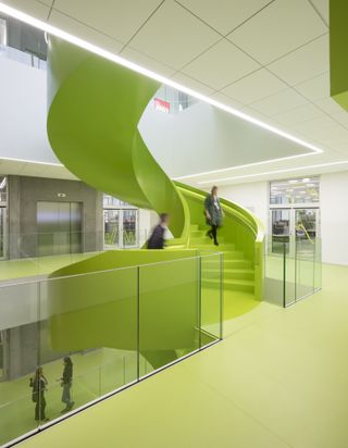 Lime green stairwell inside a Lego campus building