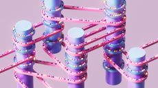 A series of purple vertical cylinders wrapped with pink and blue bands with various colored balls moving across them