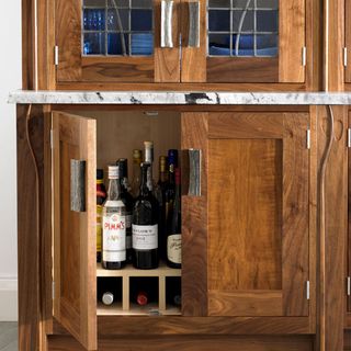 kitchen wooden cabinets drinks bottles