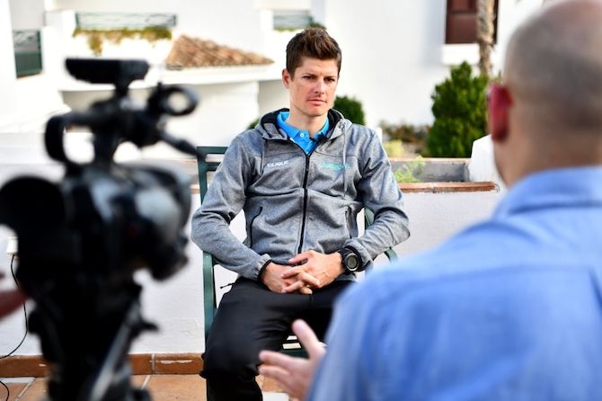 A relaxed-looking Jakob Fuglsang fields questions from the press