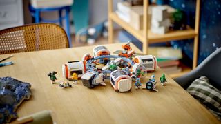 A lifestyle shot showing the Lego City Modular Space Station set on a tabletop
