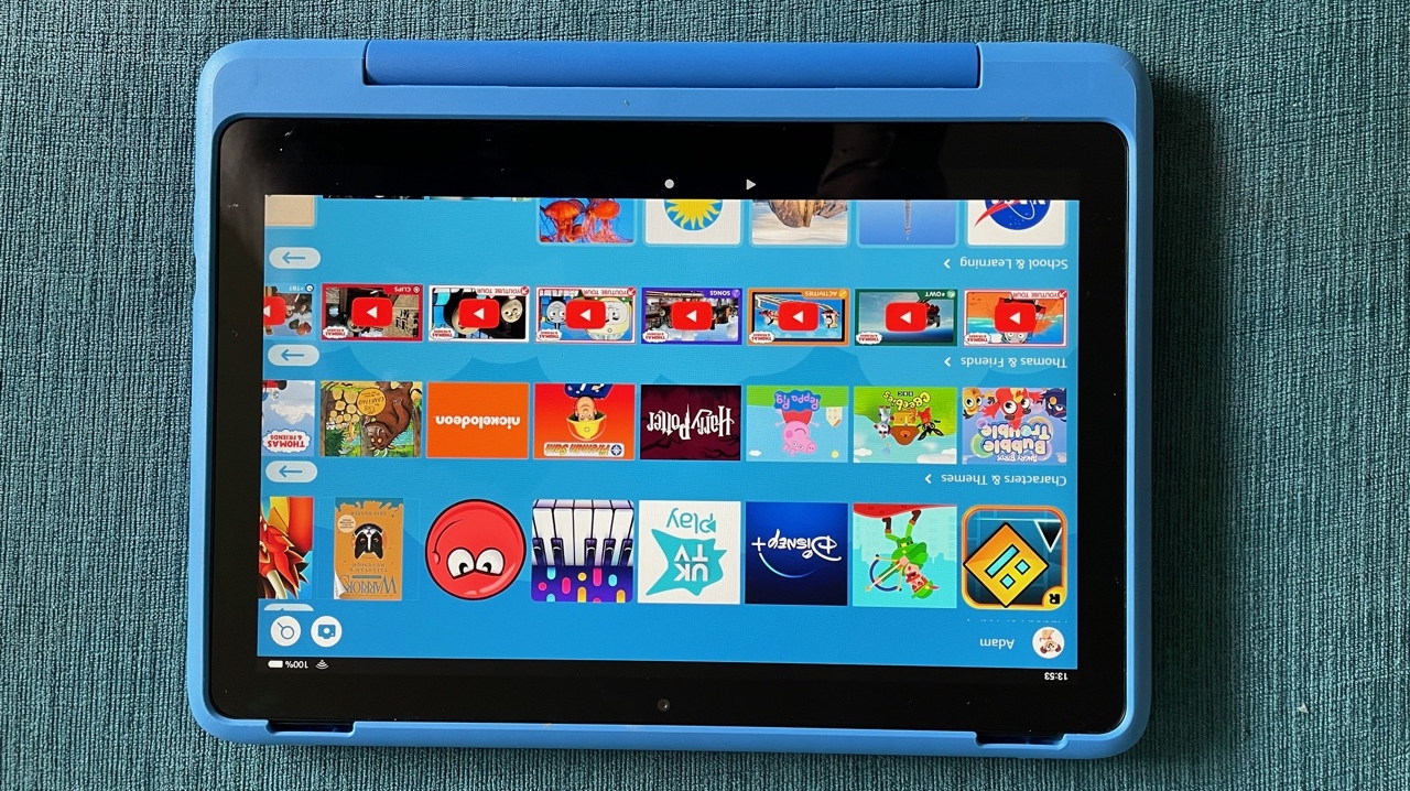The Amazon Fire HD 10 Kids Pro on a blue surface