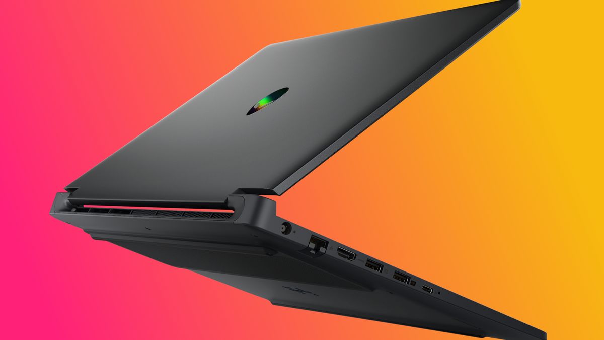 A sleek, black laptop partially open against a vibrant pink and orange gradient background. Various ports are visible, conveying a modern and tech-savvy mood.