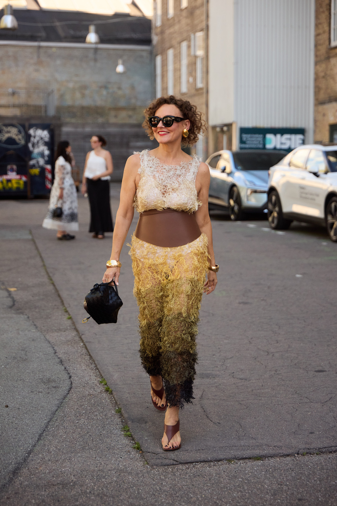 woman wearing heeled flip-flops in Copenahagen.