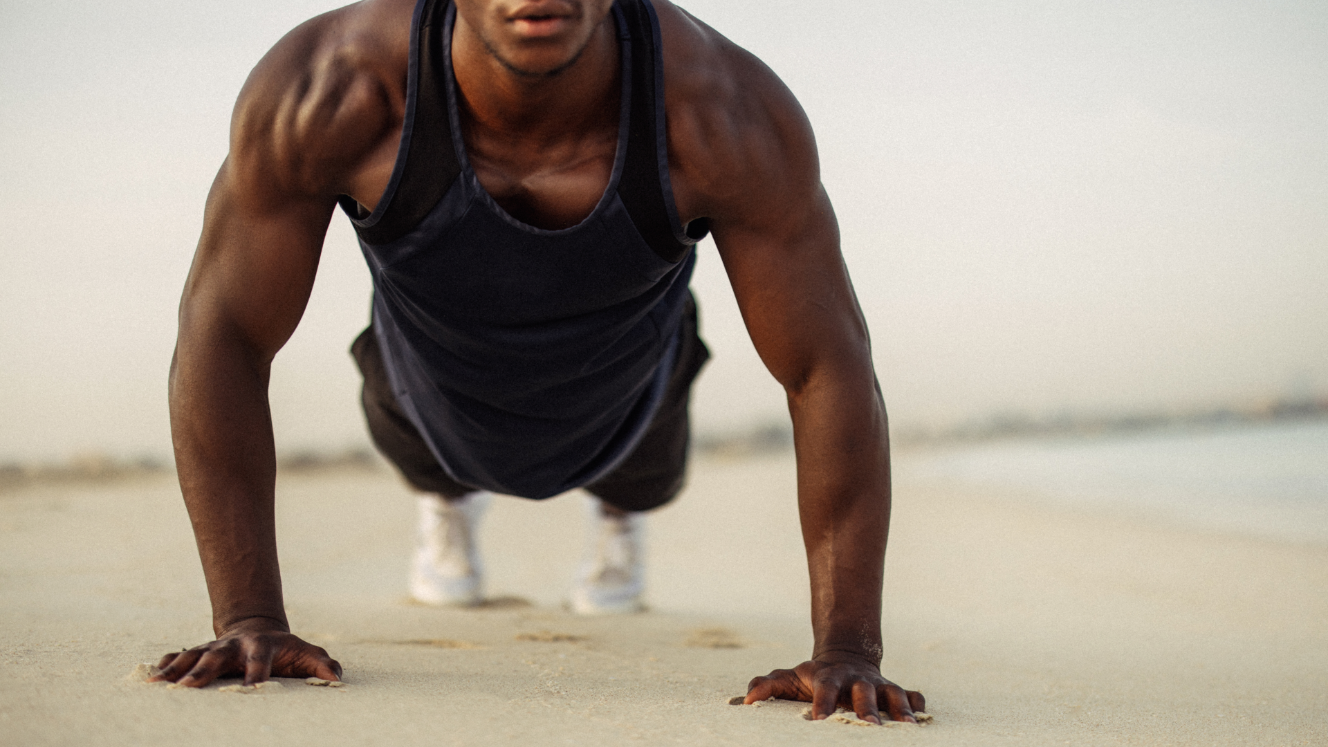A man performing a push up outdoors