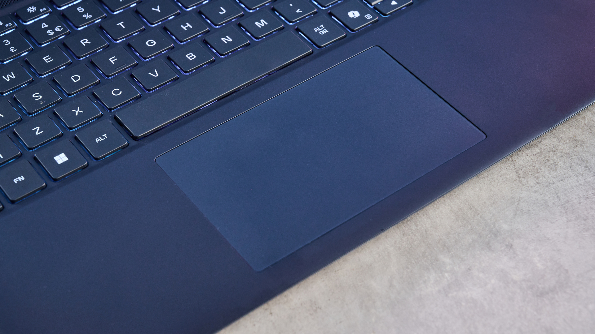 A blue Alienware 16X Aurora gaming laptop