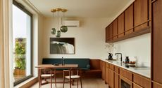 A kitchen with built in seating