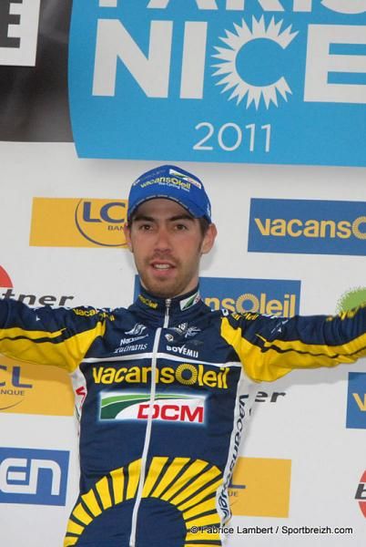 Thomas De Gendt (Vacansoleil-DMC) on the podium to receive his yellow jersey.