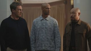 Jon Hamm, Mark Tallman and Hoon Lee looking at each other in Your Friends and Neighbors. 