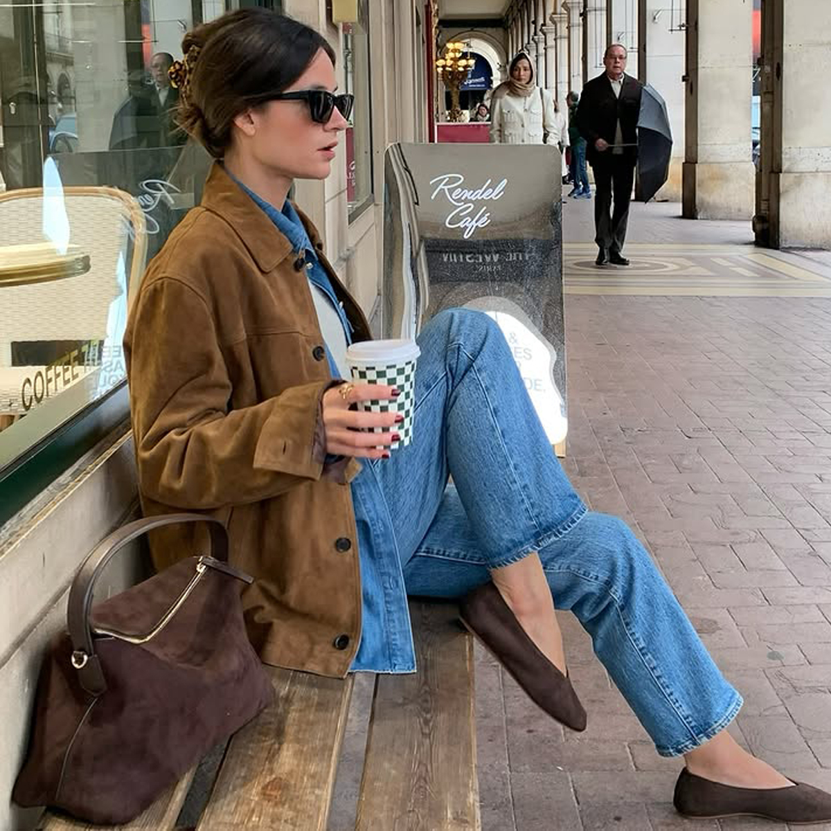 @leasy_inparis wears a tan suede jacket, denim shirt, blue jeans and brown ballet flats