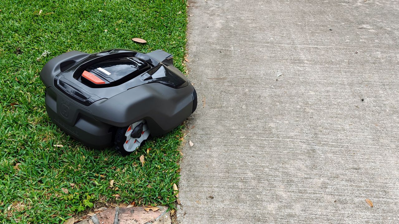 Husqvarna Automower 450XH Robotic Lawn Mower being tested in writer's yard