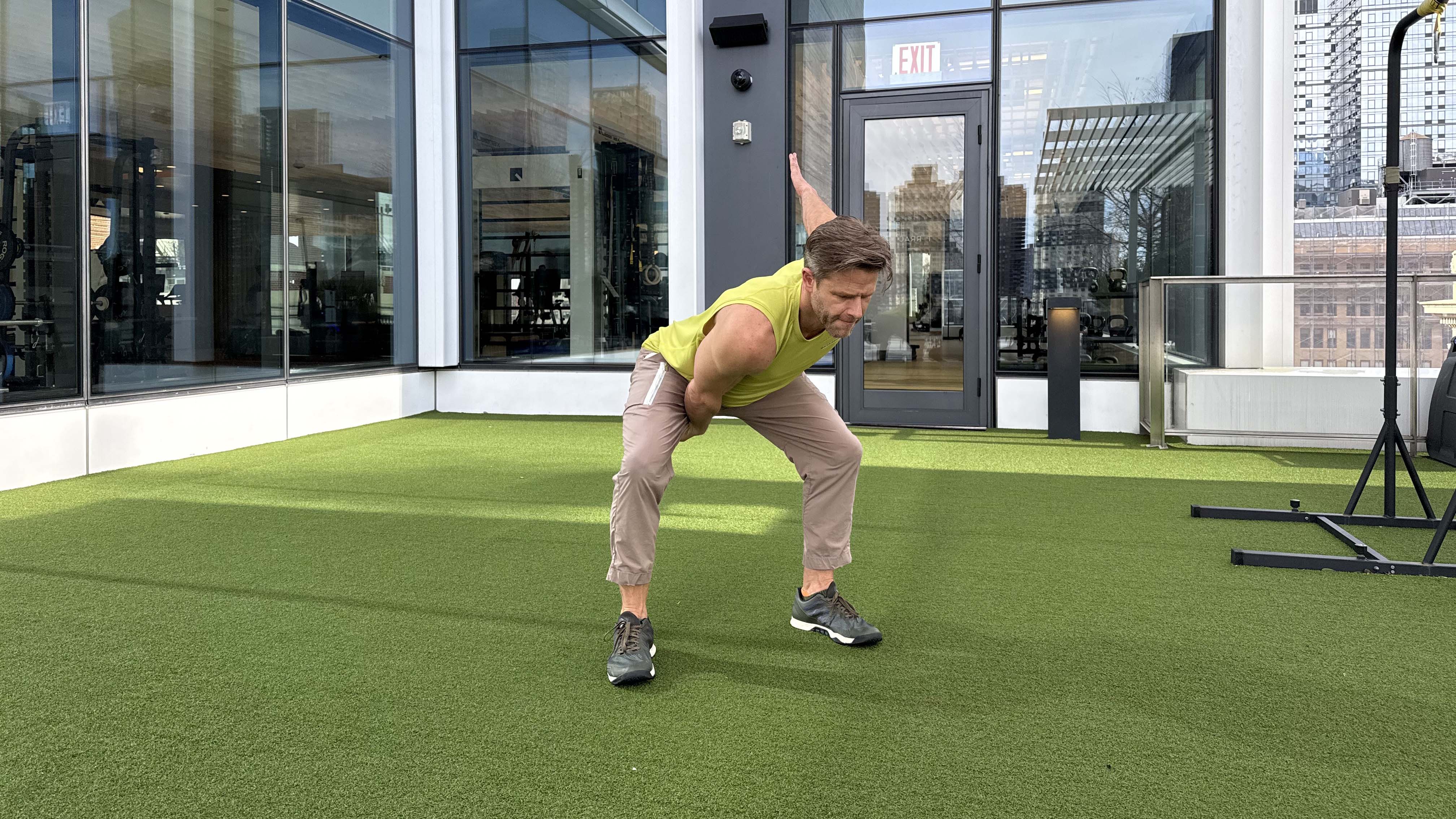 a photo of Peloton trainer Andy Speer doing a kettlebell single-arm clean