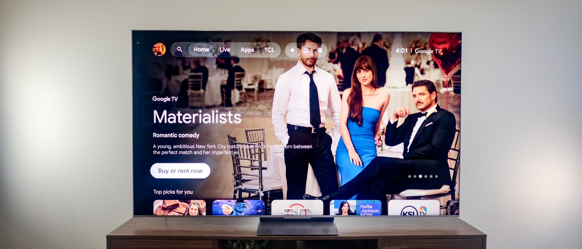 A TCL QM9K TV on a side table