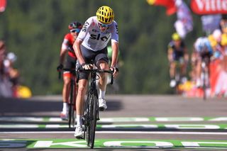 Chris Froome stops the clock with the maillot jaune