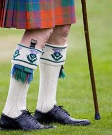 A dirk tucked into a man's sock is a common sight at events such as the Braemar Games Highland Gathering.