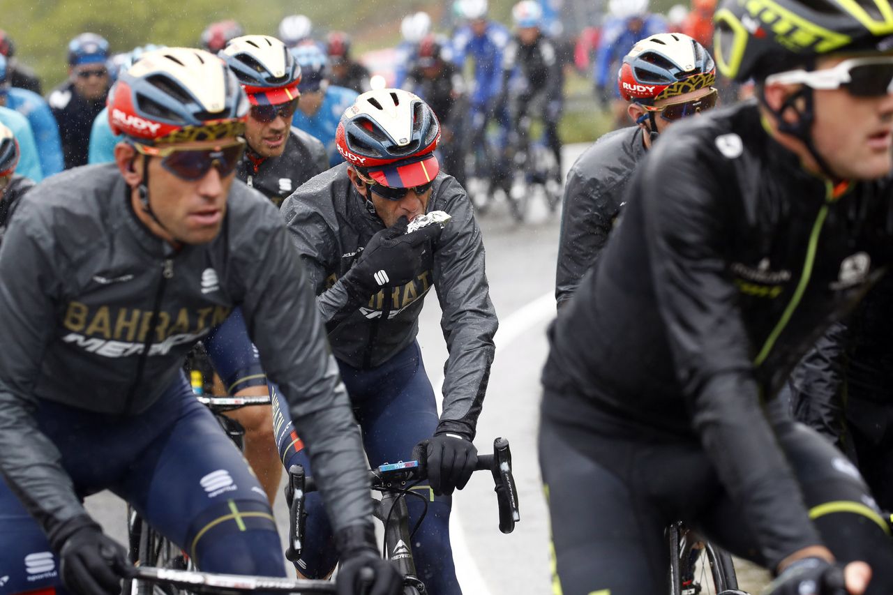 Vincenzo Nibali (Bahrain-Merida) takes a mid-stage snack
