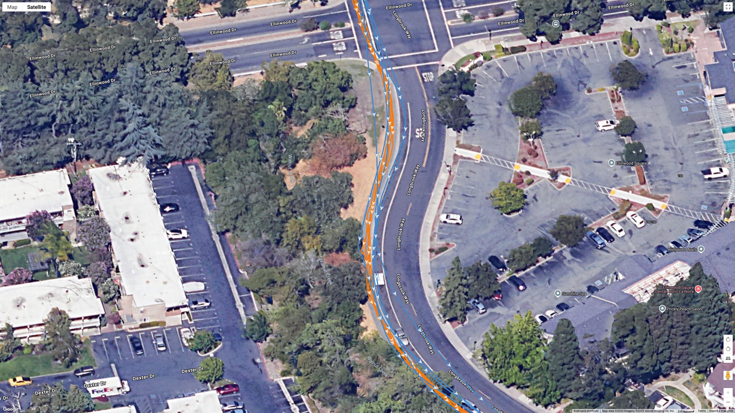 A Google Earth satellite map showing the GPS path of the Samsung Galaxy Watch 8 Classic (blue) and Garmin Forerunner 970 (orange) worn by the same runner.