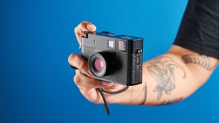 A black Fujifilm X half camera