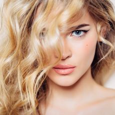 Beautiful woman with curly blond hair