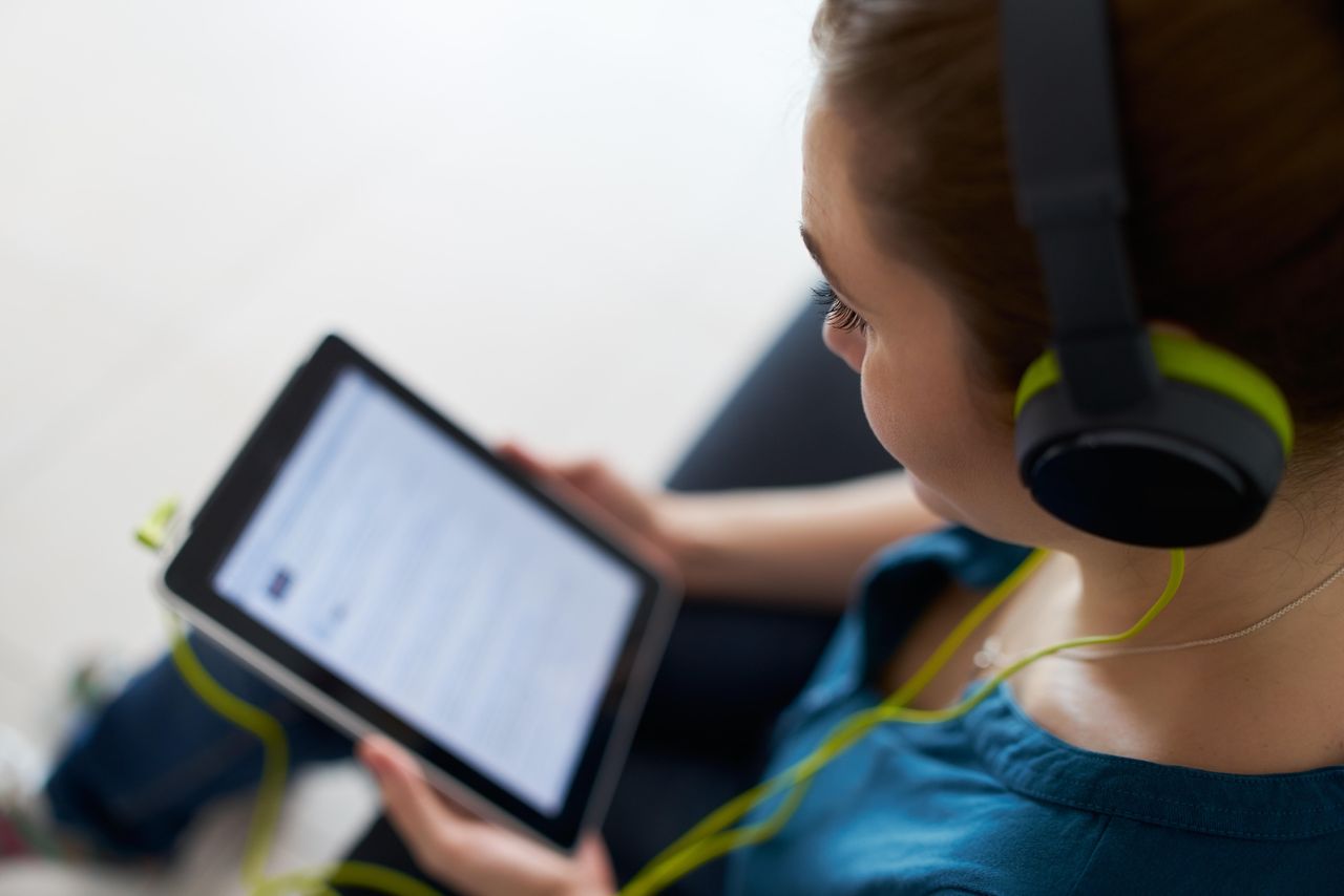 A woman wearing headphones.