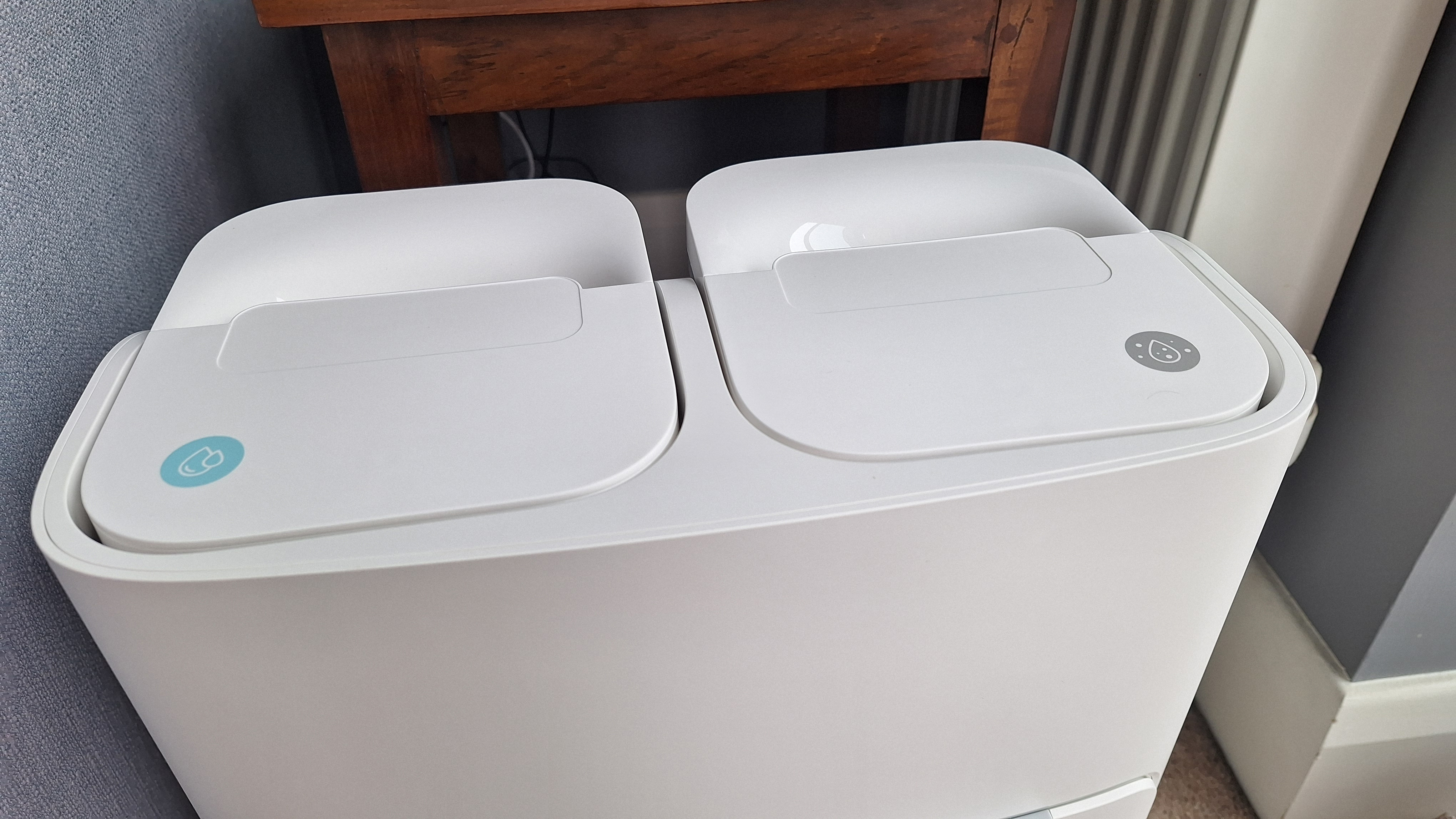 Top side of SwitchBot S20 robot vacuum dock, with clean and dirty water tanks