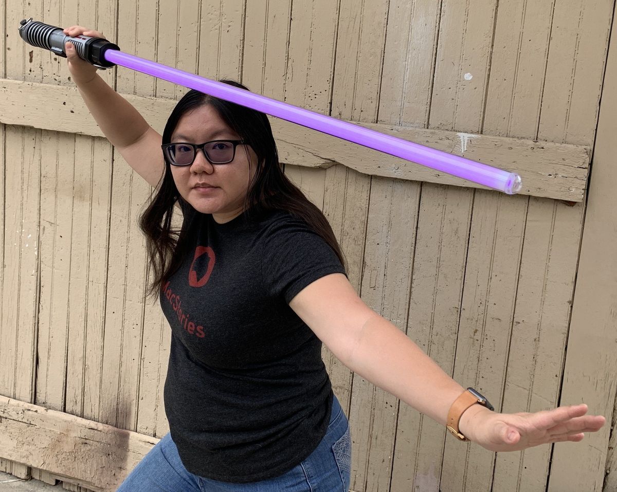 Christine poses with lightsaber