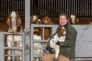 Laura Corbett, goat farmer, Wiltshire. She is pictured here two of her rare breed White Park cattle. Photograph: Millie Pilkington/Country Life Picture Library OVERS