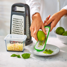 OXO cheese grater zesting a lime.