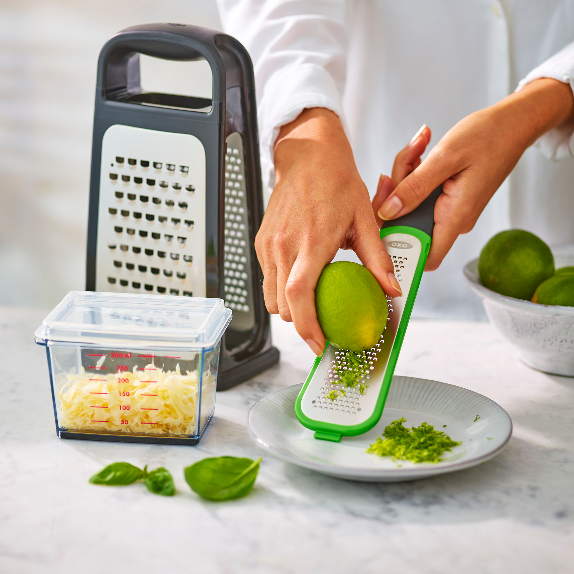OXO cheese grater zesting a lime.