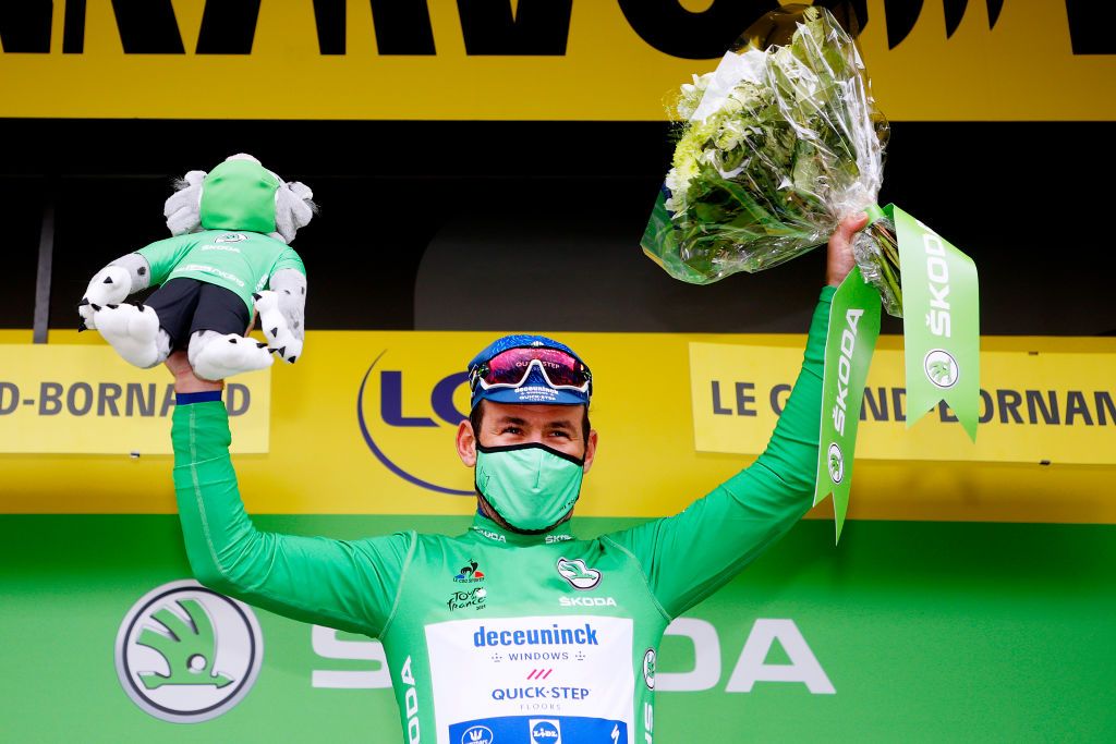 LE GRAND BORNAND FRANCE JULY 03 Mark Cavendish of The United Kingdom and Team Deceuninck QuickStep Green Points Jersey celebrates at podium during the 108th Tour de France 2021 Stage 8 a 1508km stage from Oyonnax to Le GrandBornand Mascot LeTour TDF2021 on July 03 2021 in Le Grand Bornand France Photo by Chris GraythenGetty Images