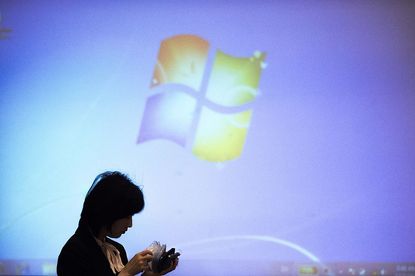The Microsoft logo appears on screen prior a meeting in Beijing.