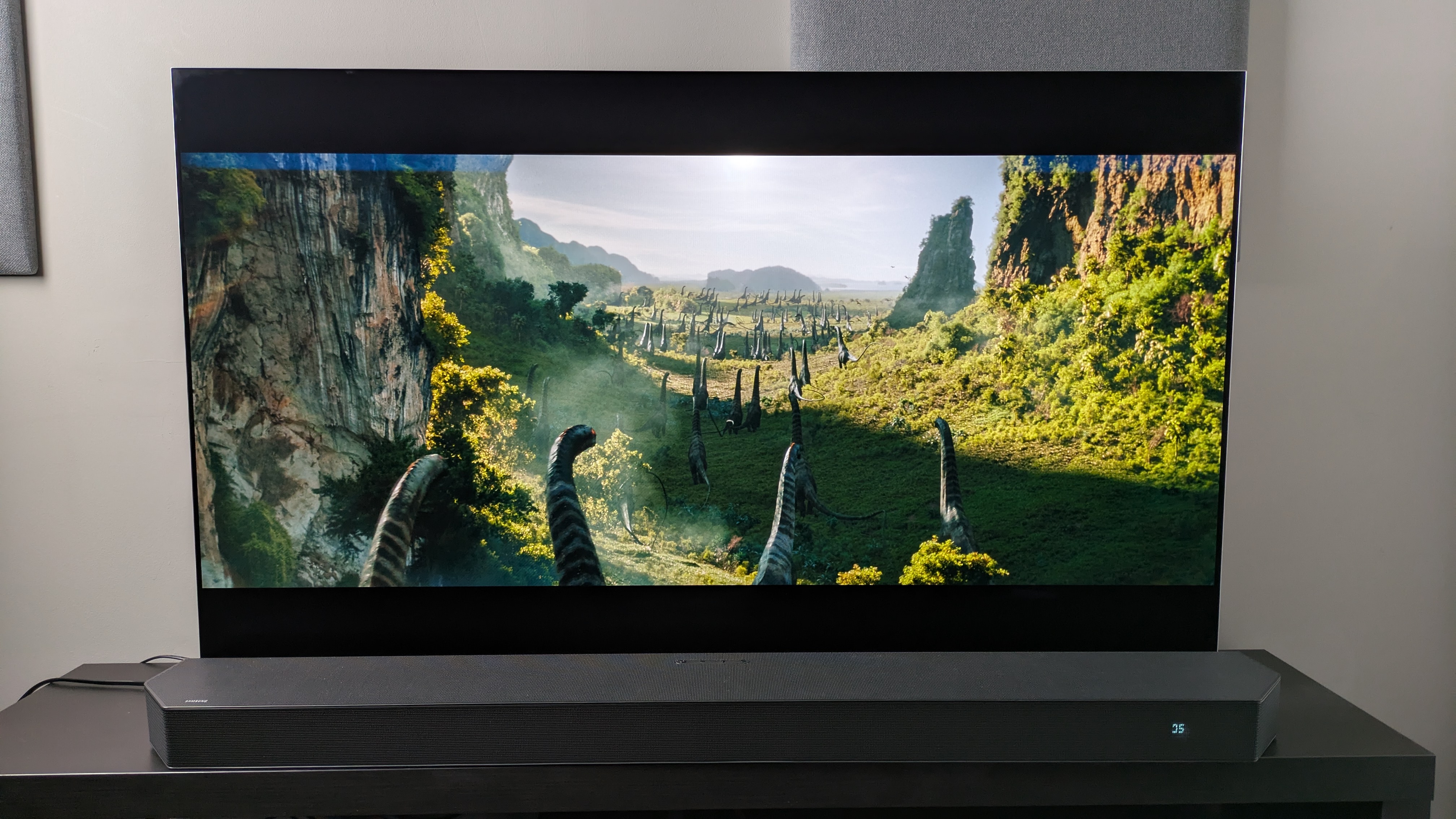 A shot of dinosaurs in a green valley from Jurassic World: Rebirth 4K Blu-ray on LG G5 screen