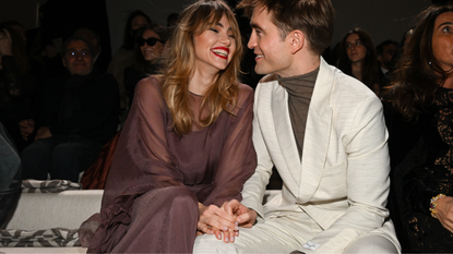 Suki Waterhouse and Robert Pattinson attend the Dior Fall 2023 Menswear Show on December 03, 2022 in Giza, Egypt.